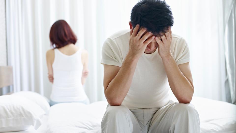 A dating couple with relationship problem appear depressed and frustrated inside their room